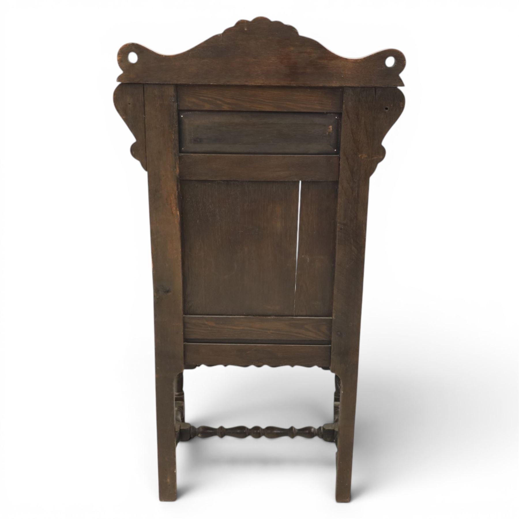 17th century style carved oak Wainscott chair, intricately carved back, united by a turned stretcher