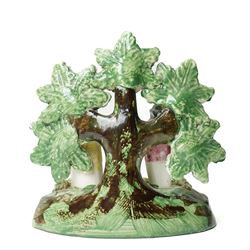 Pair of 19th century Staffordshire sheep, W13cm; together with a pearlware bocage group, H12cm (3)