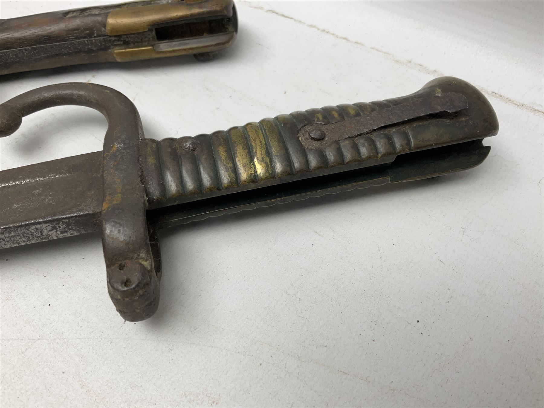 Five 19th century bayonets in relic condition without scabbards comprising British Pattern 1876 socket bayonet with Indian markings; French Model 1874 epee bayonet; and three French Model 1866 sabre bayonets (5)