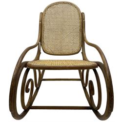 Early 20th century Michael Thonet design bentwood rocking chair, with cane seat and back (W52cm H82cm); Edwardian rocking chair with mauve upholstered back and seat (W43cm H70cm)