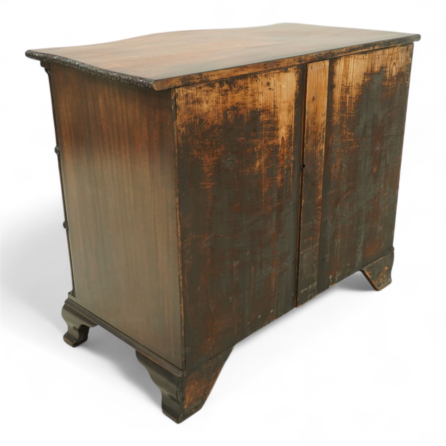 Georgian design mahogany serpentine chest, with rectangular top with floral rosette carved edge, cluster reeded columns with brush slide above four graduated drawers on ogee bracket feet 