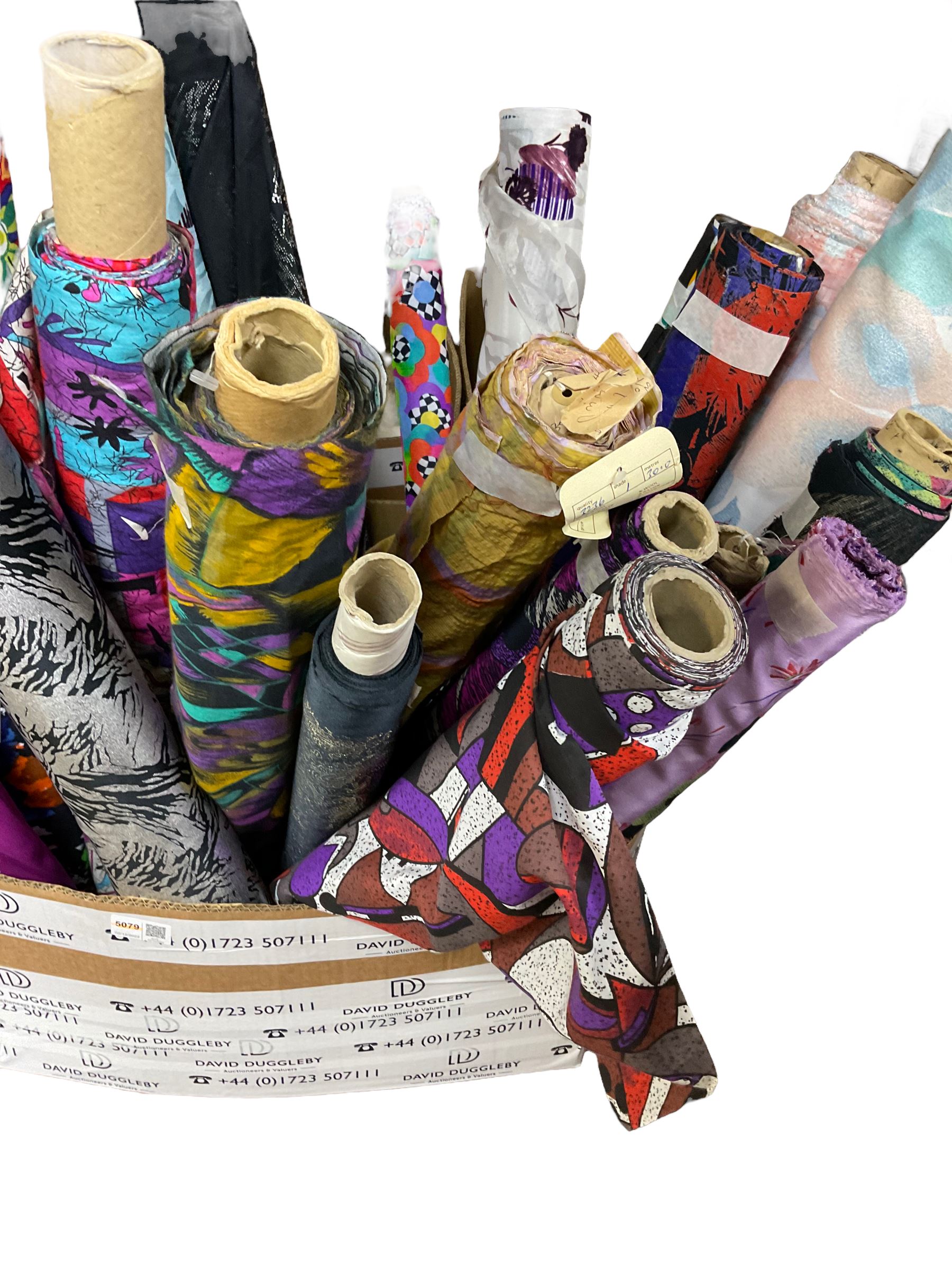 Haberdashery Shop Stock: Various rolls of fabric including metallic printed stage satin, abstract and geometric patterns, children's and festive fabric, and others (qty) in two boxes