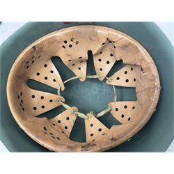 1960s Italian parachutist helmet with liner; camouflage paintwork with parachutist crest to the front