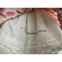 Anna Meszaros Hungary - three hand made needlewrok figurines - each wearing a lon floral dress and bonnet and holding a bouquet of flowers, tallest H32cm (3)  Auctioneer's Note: Anna Meszaros came to England from her native Hungary in 1959 to marry an English businessman she met while demonstrating her art at the 1958 Brussels Exhibition. Shortly before she left for England she was awarded the title of Folk Artist Master by the Hungarian Government. Anna was a gifted painter of mainly portraits and sculptress before starting to make her figurines which are completely hand made and unique, each with a character and expression of its own. The hands, feet and face are sculptured by layering the material and pulling the features into place with needle and thread. She died in Hull in 1998.