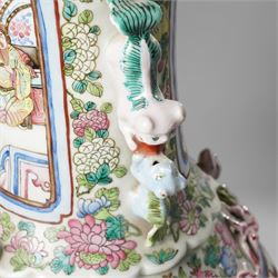 Large pair of 19th century Cantonese famille rose vases, each painted with various courtly scenes, including a display of warriors fighting on horseback before an official and his attendants, double Buddhist lion handles and applied at the shoulders with chilong, the lower band painted with Greek key motif, H58cm (2)