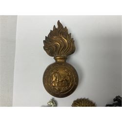 Nineteen Yeomanry metal cap badges including Derbyshire, Northamptonshire, Essex, Glamorgan, Staffordshire, City of London, Surrey, Shropshire, Hertfordshire etc; together with eleven Fusiliers badges including Lancashire, Royal Welch, Northumberland etc (30)