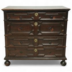 Late 17th-century oak chest, rectangular top above four graduated drawers with geometric panel mouldings, in two sections, supported on bun feet 