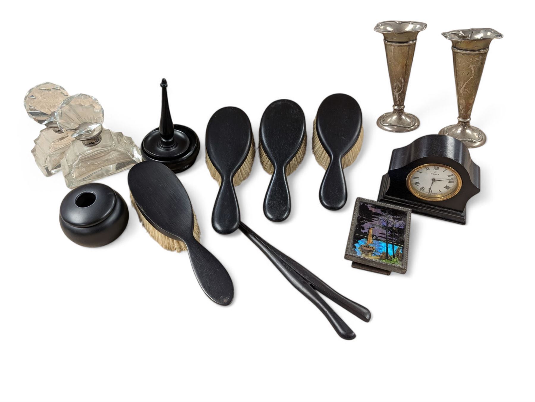 Pair of silver bud vases, pair of scent bottles with silver collars, butterfly wing picture and an ebony dressing table set