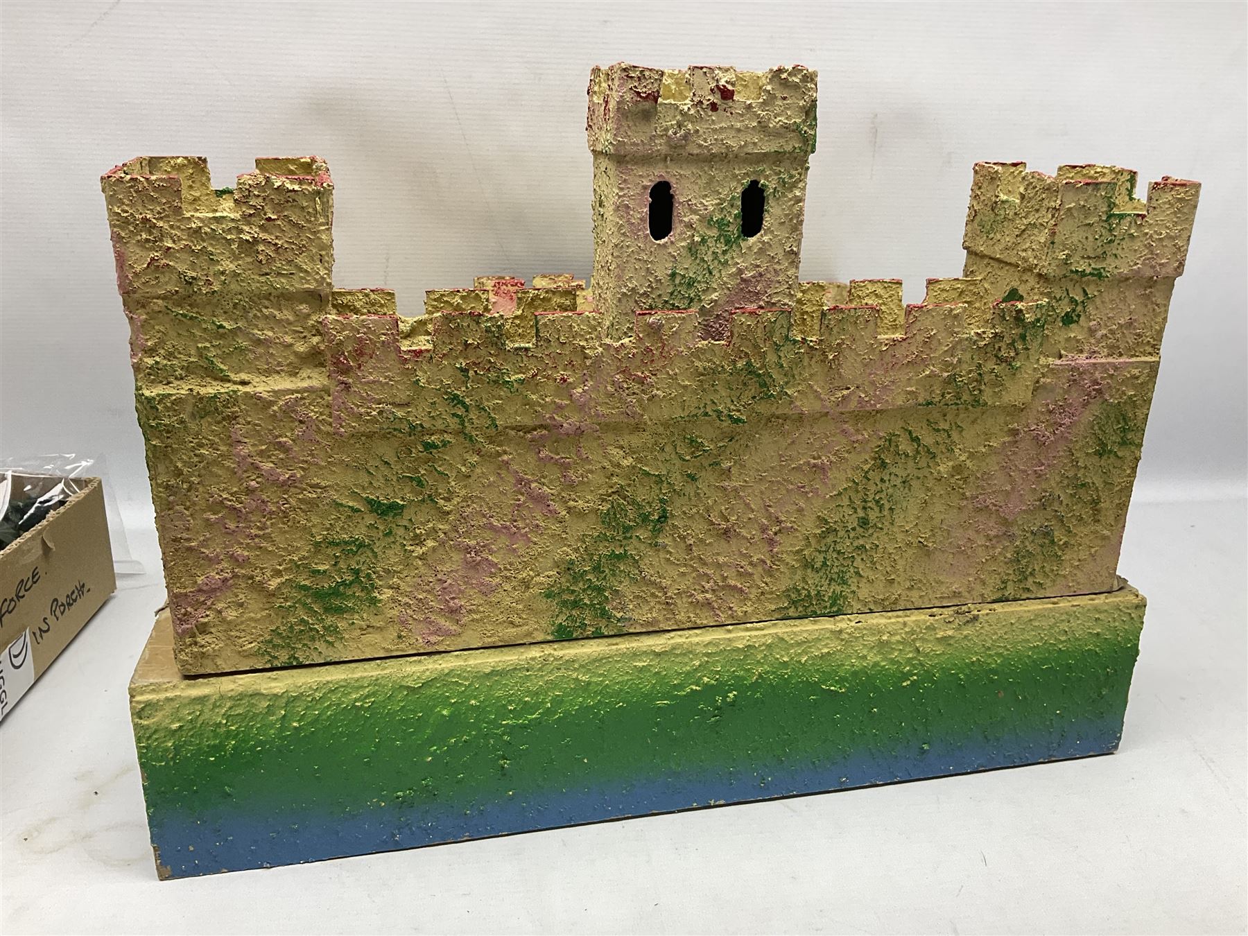 Sectional wooden fort on base with painted textured finish 46 x 36cm; together with over thirty lead and die-cast white metal soldiers and horses by various makers; and a small quantity of plastic figures of soldiers