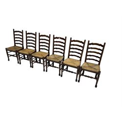Late 20th century set six ladder back dining chairs, with rush seats