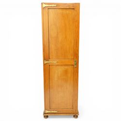 Late 19th century Arts & Crafts stained pine single hall wardrobe, single panelled door with brass fittings enclosing sliding tray to top with hanging rail and hooks, hinged box seat to base, on compressed bun feet