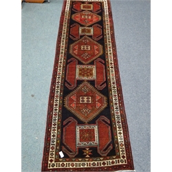  Azerbaijan red and black ground rug, geometric pattern, 400cm x 117cm  