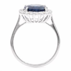 18ct white gold sapphire and diamond cluster ring, single cushion cut sapphire of approx 4.20 carat, surrounded by twenty round brilliant cut diamonds, stamped 750, total diamond weight approx 0.50 carat