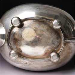 Silver tea pot of oval form with ebonised handle and lift on compressed bun feet Sheffield 1919 Maker Atkin Bros.