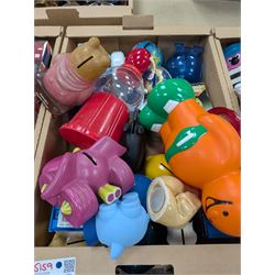 Large collection of vintage money boxes and charity boxes, including plastic, wooden, tin and ceramic examples, of various designs including Paddington, Dunlop, Jellybabies, Meerkat, Halifax Houses, Pigs, etc