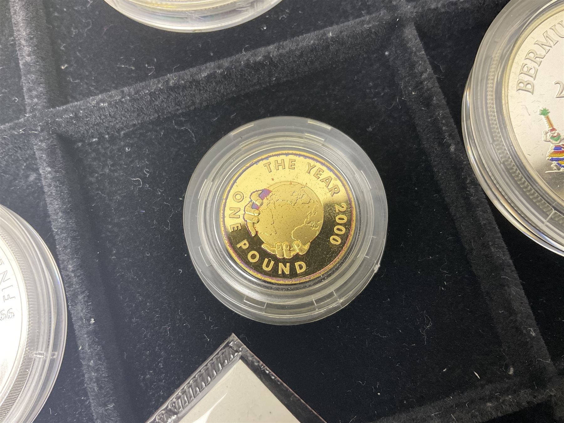 Single owner lifetime collection of mostly commemorative modern World coins with gold, silver and base metal examples, including two Queen Elizabeth II Bailiwick of Guernsey twenty-five pound gold coins 'The 1999 Royal Wedding' and '100th Anniversary of the End of the Victorian Era' 2001 each in 24 carat gold weighing 7.81 grams with certificates, silver coins commemorating the Millennium 2000 including Guyana sterling silver proof two-thousand dollars, Fiji sterling silver proof five dollars etc, silver coins from the Queen Elizabeth II Golden Jubilee Collection dated either 2002 or 2003 from Great Britain and the Commonwealth countries, United Kingdom commemorative crowns in card folders, The Royal Mint United Kingdom 1997 proof coin set in red folder without certificate etc