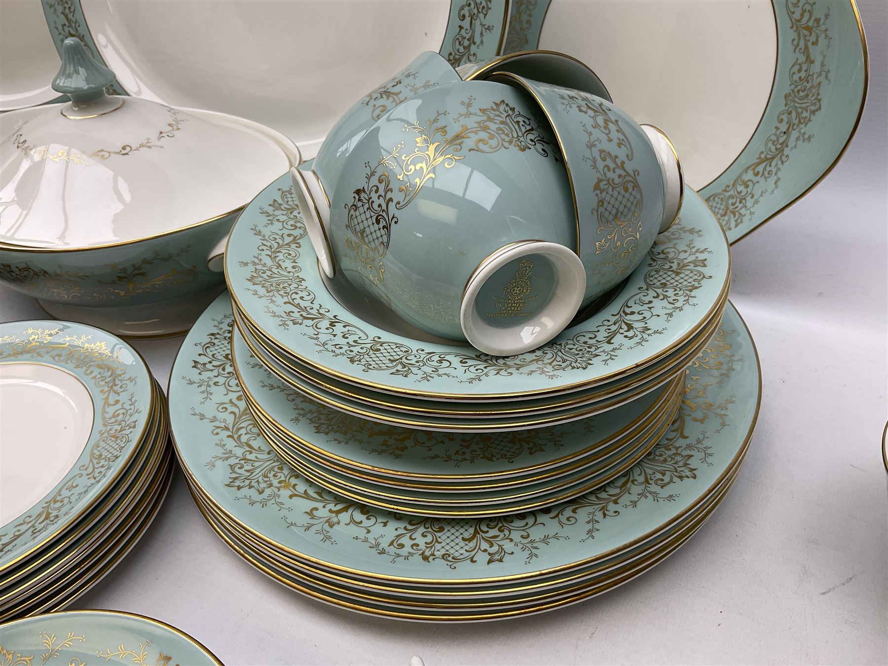 Royal Doulton De Lamerie pattern part tea and dinner service, including eight dinner plates, seven side plates, seven bowls, two serving platters, seven cups and saucers, milk jugs, sucrier, etc (58)