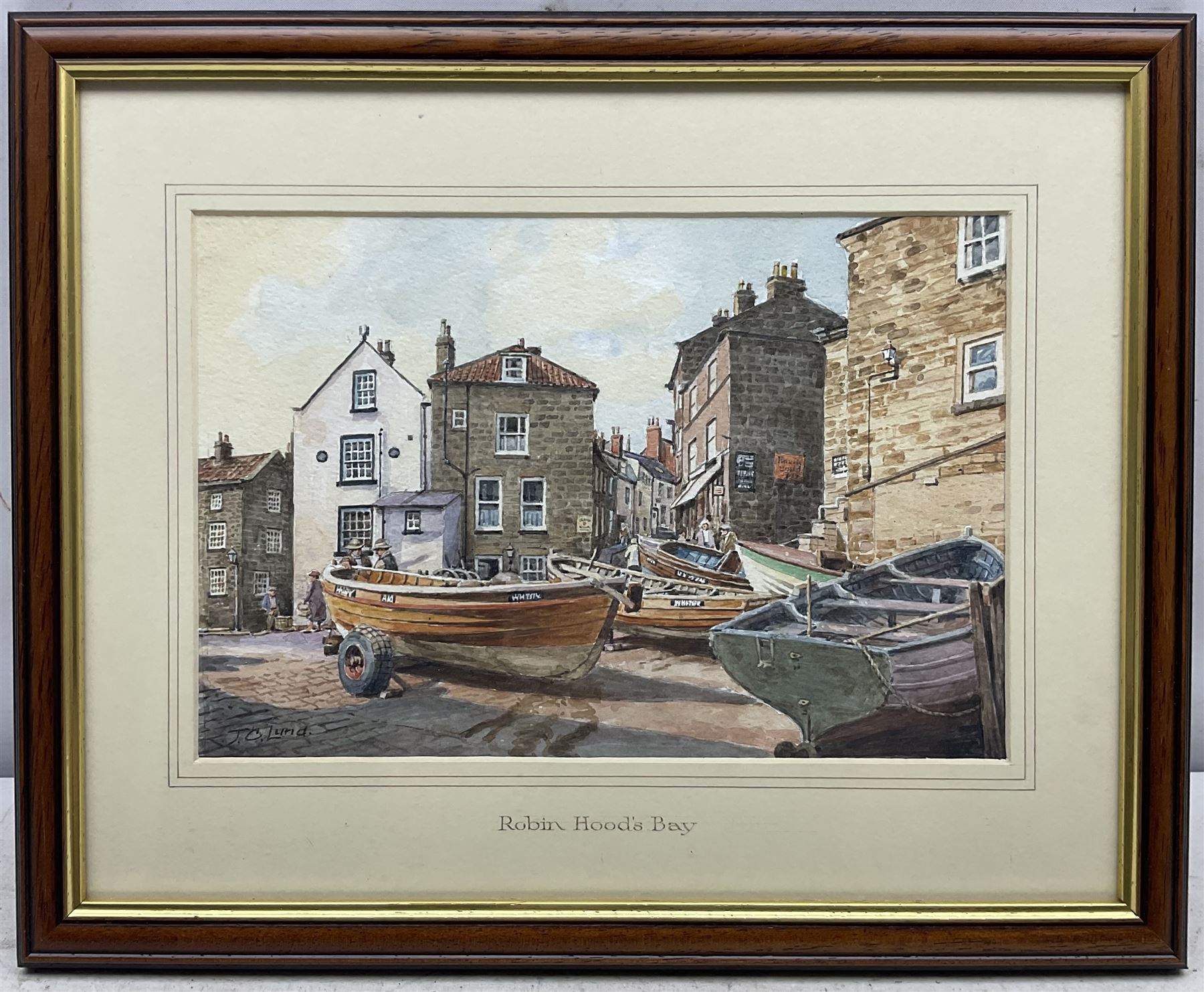 John Cecil Lund (British 1932-): Cobles at Robin Hood's Bay, watercolour signed 18cm x 27cm