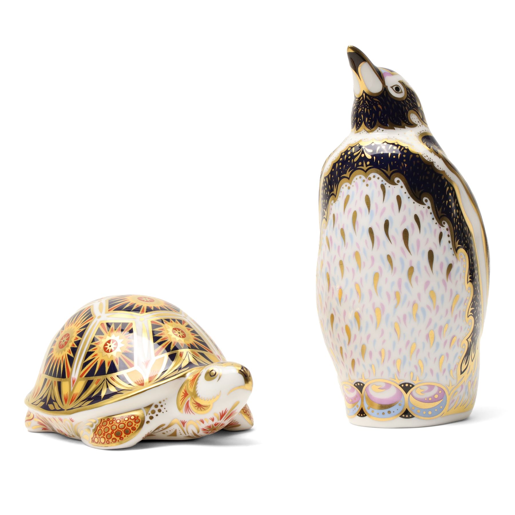 Royal Crown Derby paperweights, Galapagos Penguin limited edition 177/1000 and Madagascan Tortoise 177/1000, both from the Endangered Species series with gold stoppers and certificates