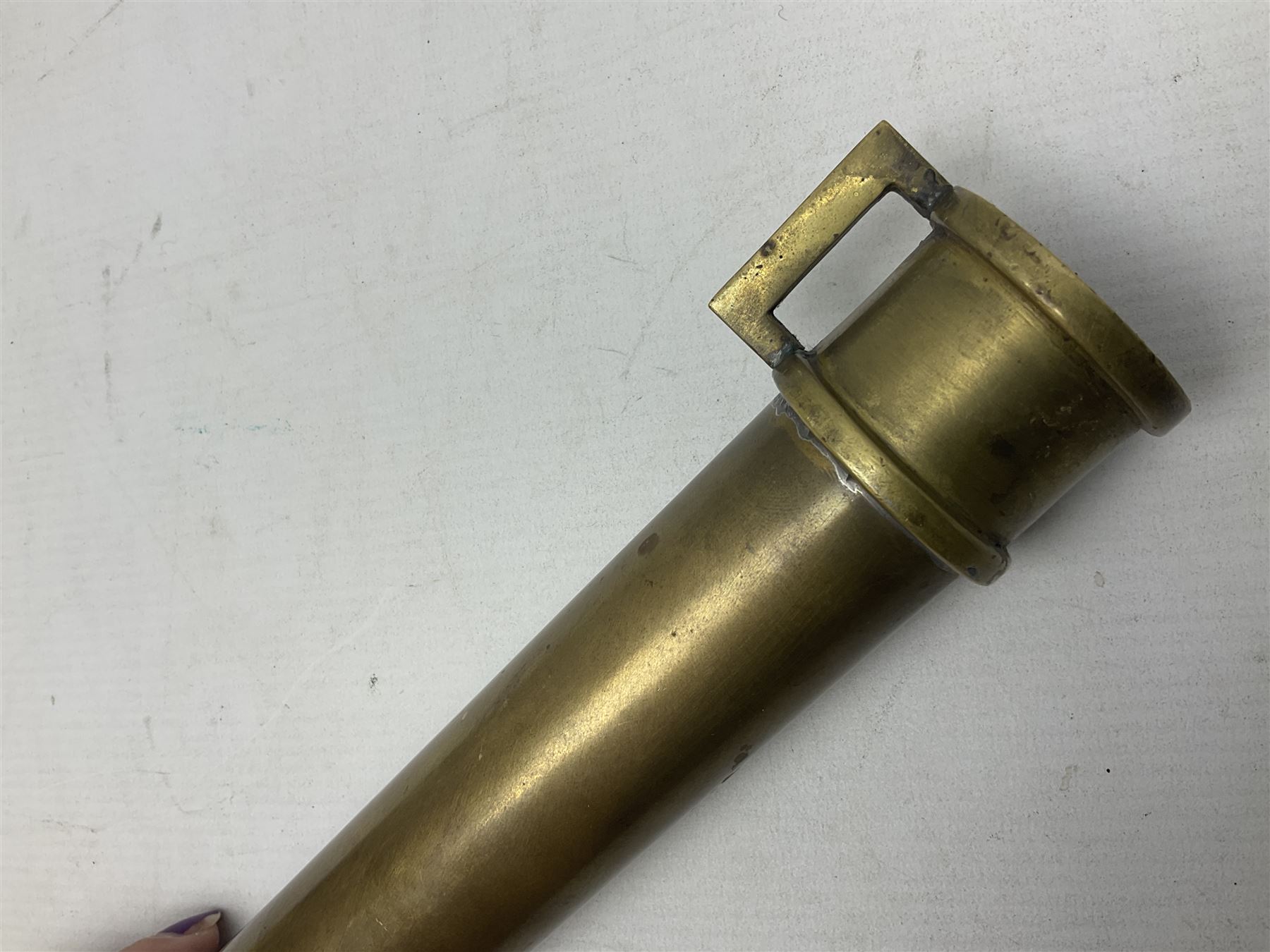 French Naval divers brass handled knife, the 20.5cm single edged steel blade held in place with wooden wedges, tapering ribbed grip with domed pommel and original screw-on scabbard with drain hole L38cm overall