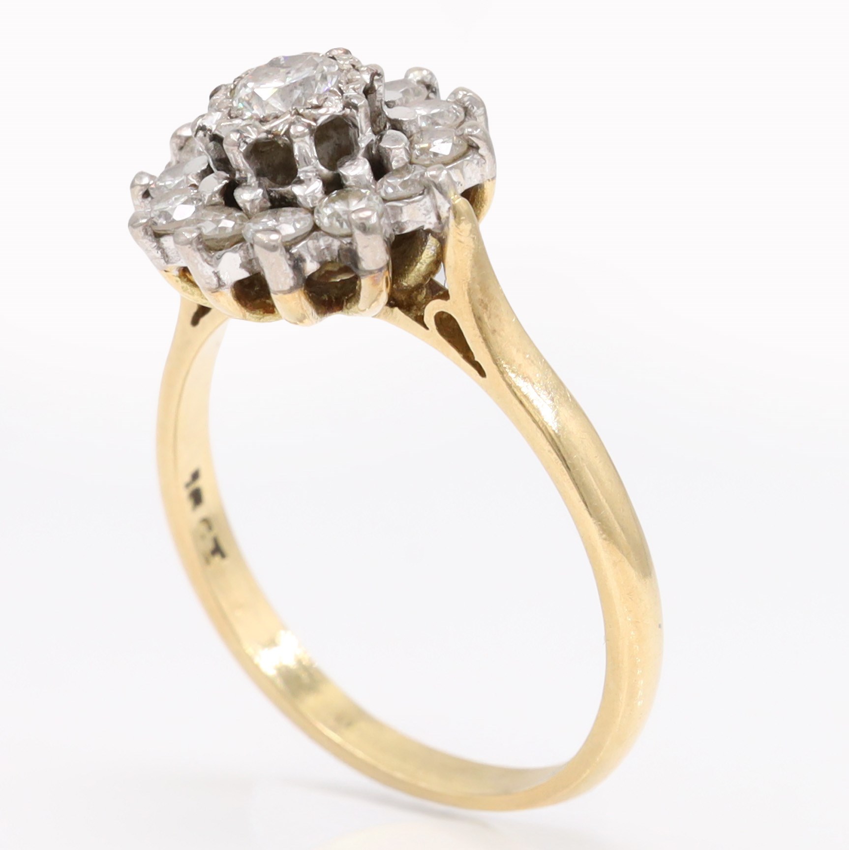 Gold diamond flower head cluster ring, single round brilliant cut diamond, surrounded by twelve further diamonds, stamped 18ct