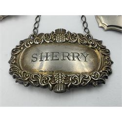 Five modern silver decanter labels, to include two sherry examples, embossed with scrolls and fruits, hallmarked W I Broadway & Co, Birmingham 1991 & 1997, a similar claret example, hallmarked S J Rose & Son, Birmingham 1973, and two plain shaped port and burgundy examples, hallmarked C Robathan & Son, Birmingham 1997 and A Haviland-Nye, London 1968