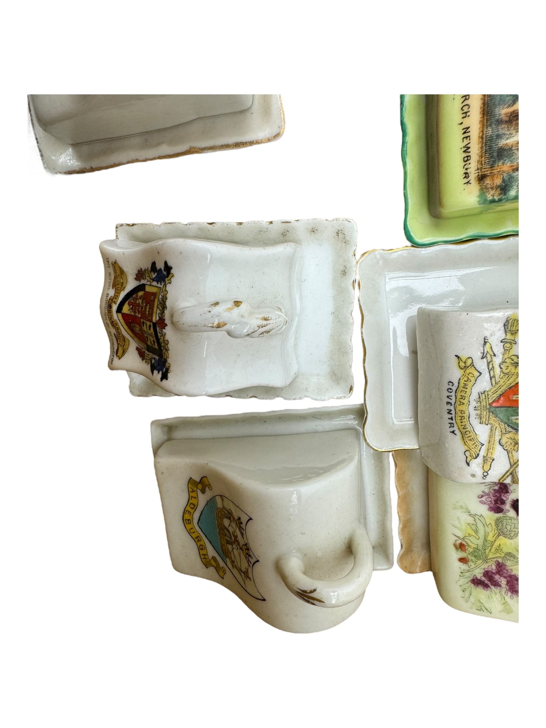 Collection of crested ware miniature cheese dishes and covers, including one by Goss, in one box