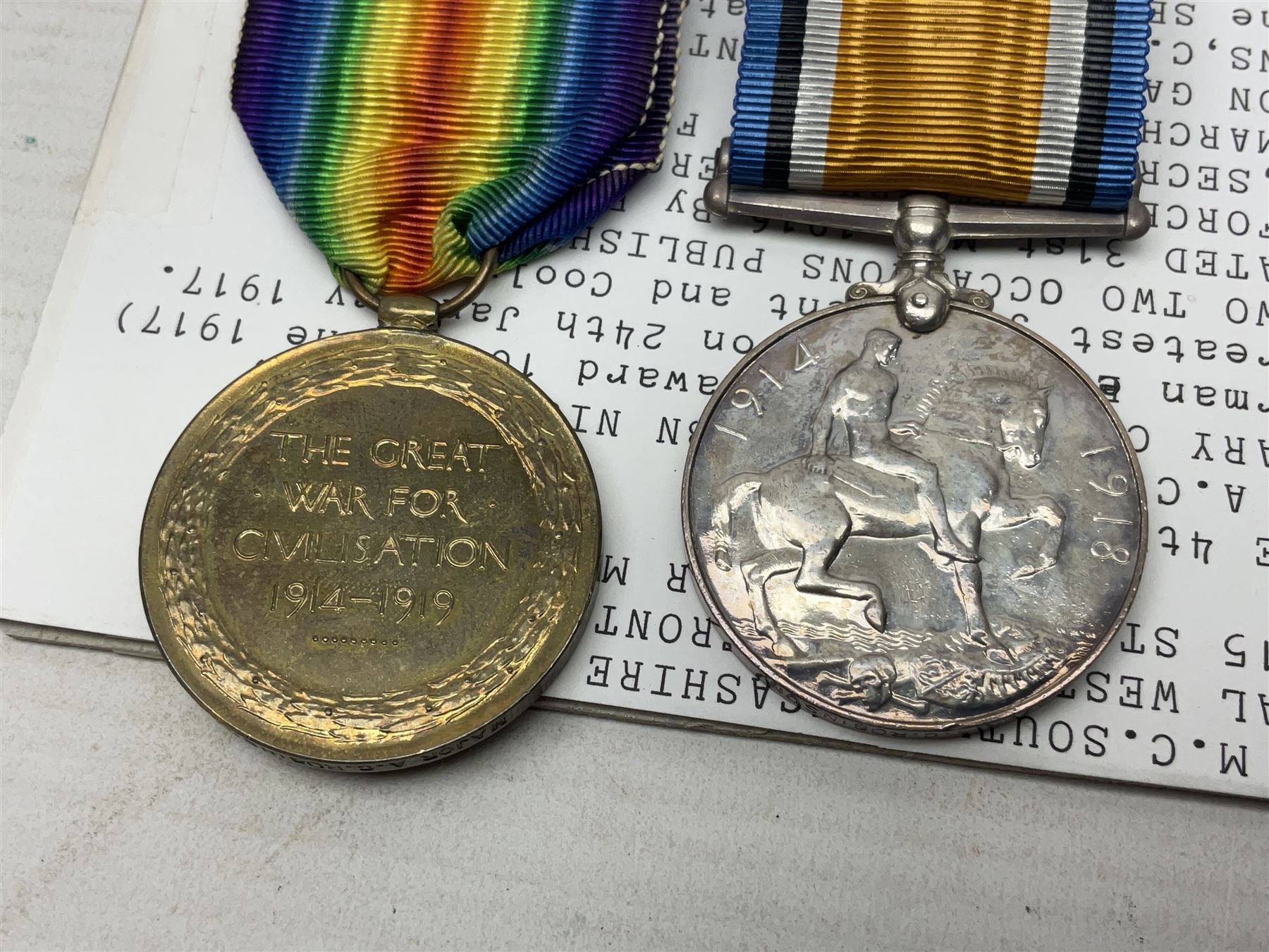 WWI Military Cross group of four awarded to Major Alfred Conrad Robinson South Lancashire Regiment and 3rd Battalion Nigeria Regiment Royal West African Frontier Force comprising MC, British War Medal and Victory Medal with oak leaf, and 1914-15 Star (to Lieut. A.C. Robinson); Military Cross London Gazette 4th June 1917. Bar to Military Cross (Capt. A.C. Robinson 3rd Bn. Nigeria Regt. RWAFF won a bar to his Military Cross (date of award 10th June 1917) for his action at Ngwembe German East Africa on 24th January 1917 for 'Handling his company with great judgement and coolness'. Recommended for a bar to his MC dated 10th June 1917 but never recorded (copy bar included with the medals).Mentioned in despatches on two occasions. Published in the London Gazette Supplements dated 31st May 1916 by Brig-Gen F.J. Cunliffe, commanding Allied Forces Northern Cameroons to the Rt.Hon. A. Bonar Law MP P.C. Secretary of State for the Colonies, H.Q. Nigeria Regiment, Lagos, 16th March 1916; and again London Gazette Supplement 7th March 1918 from Major-Gen A.R. Hoskins C.M.G. D.S.O. Late Commander-in-Chief East Africa Force to the Secretary of Stae for war 5th March 1918; together with an extensive archive of research information and the original bill of purchase from Spink & Son dated 4/11/1959