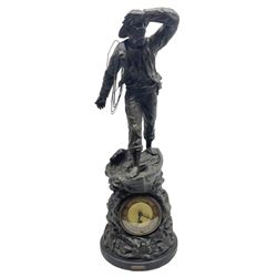 Early 20th century spelter effect figure of a sailor standing in the bow of a boat scanning the horizon, on a simulated rock base with a plaque entitled 'Rescue', base fitted with a timepiece clock movement and two-part dial, with pierced hands, gilt dial centre and ivorene chapter ring written in Arabic numerals, German HAC spring driven going barrel movement wound from the front; with pendulum H65.5cm
