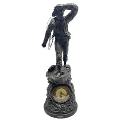 Early 20th century spelter effect figure of a sailor standing in the bow of a boat scanning the horizon, on a simulated rock base with a plaque entitled 'Rescue', base fitted with a timepiece clock movement and two-part dial, with pierced hands, gilt dial centre and ivorene chapter ring written in Arabic numerals, German HAC spring driven going barrel movement wound from the front; with pendulum H65.5cm
