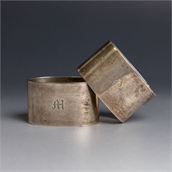 Two silver napkin rings, of oval form with engraved initials, both hallmarked