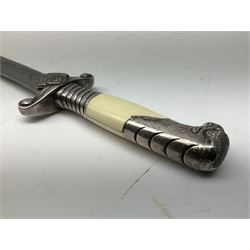 German Reichsarbeitdienst RAD Leader's Hewer dagger, the 26cm single edged scimitar shaped blade with narrow fuller, etched Arbeit adelt; by E.D. Wusthof, Solingen; the aluminium hilt with spade and wheat ear langet; two piece white plastic grip and eagle head pommel; pebbled steel scabbard engraved with ears of wheat and strapwork with double leather hangers L40cm overall