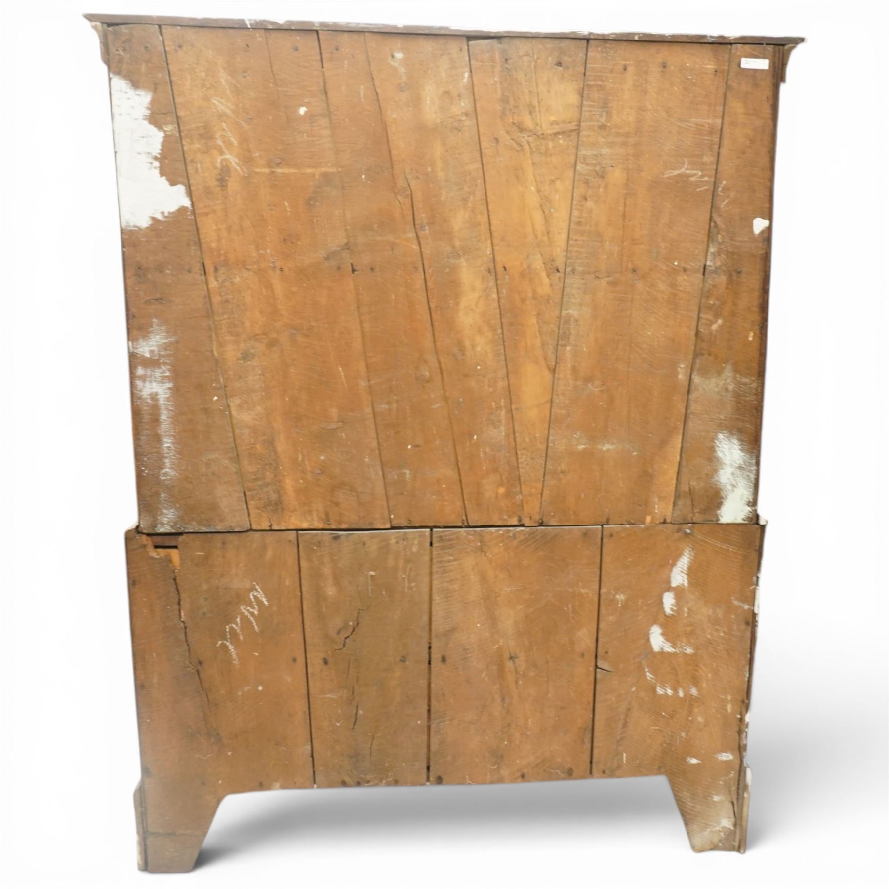 18th century oak larder cupboard, projecting moulded cornice over two panelled doors with shaped arched fielded panels, three short dummy drawers above base fitted with two short and one long drawer, turned handles, on bracket feet