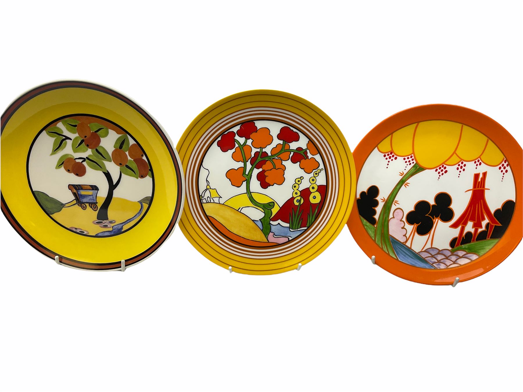 Seven limited edition Wedgwood Clarice Cliff plates, comprising Orange Roof Cottage, Caravan, Windmill, Windbells, Summerhouse, Honolulu and Bridgewater D20.5cm. 