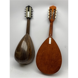 Italian lute back mandolin with segmented rosewood back and spruce top, bears label ' Cav. Giovanni De Meglio E Figlio Napoli', dated 1894, L58cm; and an Amada bowl mandolin model no.0584 with mahogany stained back and spruce top, bears label, L62cm (2)