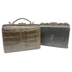 Early 20th century crocodile skin doctors bag, together with another similar doctors bag with fitted interior housing various silver-plate mounted glass bottles and bone tools, largest W35cm