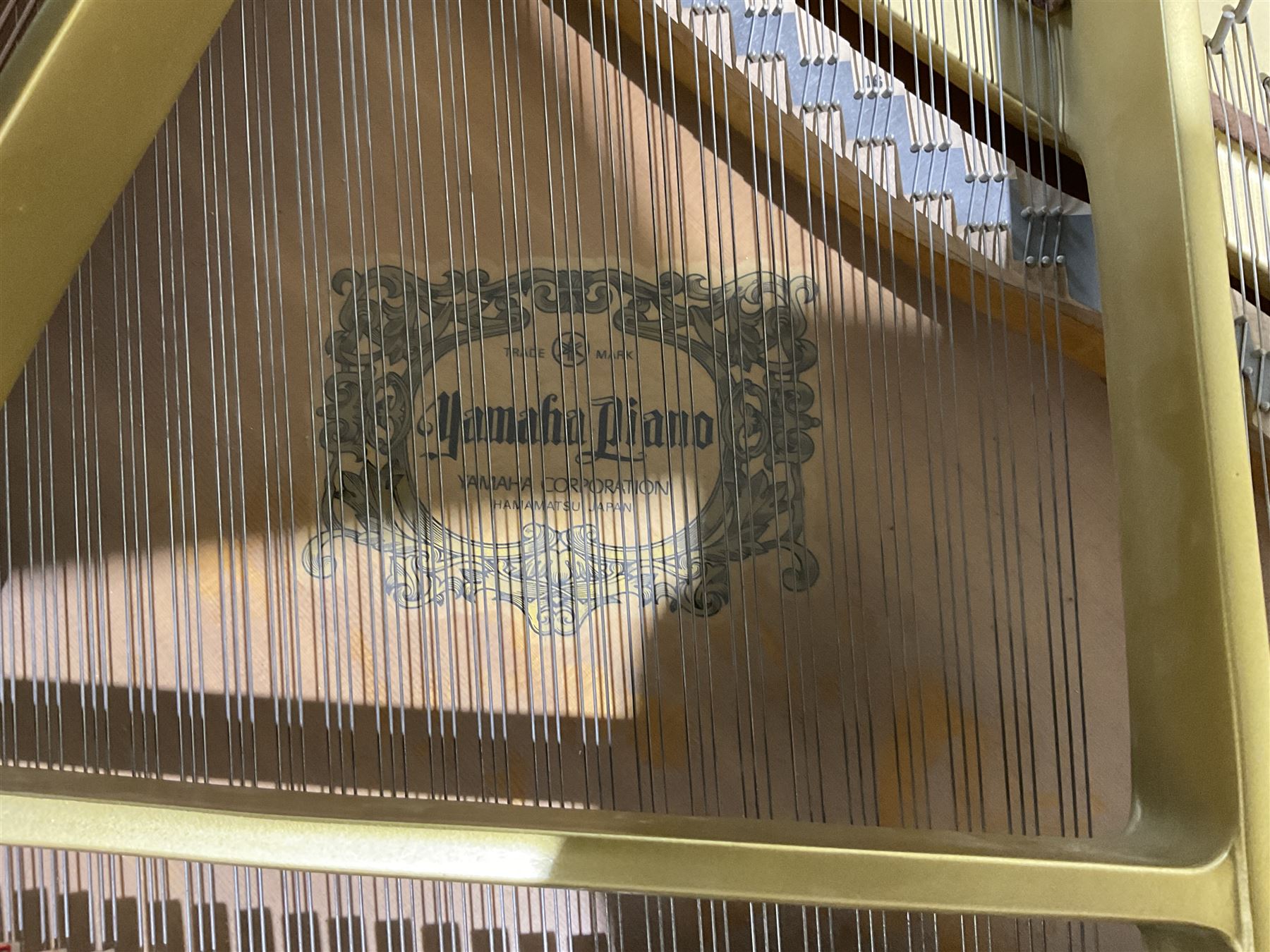 Yamaha - Baby Grand piano in mahogany polyester finish case,  G1 model, serial No 4741647, cast overstrung frame with 88 keys and seven octave compass, original stringing, tuning pins, hammers, dampers and felts, sostenuto, una corda and sustain pedals, with a solid music desk and tapered legs on brass castors.   