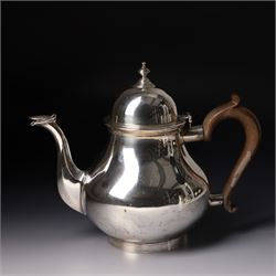 Four piece silver tea and coffee service of baluster form, the tea and coffee pots with domed covers and stained handles London 1916-1918, Maker  C S Harris & Sons Ltd