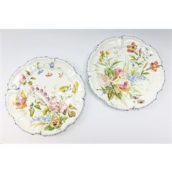 A pair of Italian faience pottery plates, by Giovanni Battista Viero, each of circular form with piecrust rim, with painted floral decoration, each with painted mark beneath, (a/f), D37.5cm