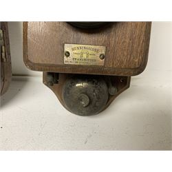 Two Hunningscone patent wall mounting telephones in walnut casing, together with Sterling Telephone & Electric Co. Ltd early wall-mounted telephone 'Primax' and one other 