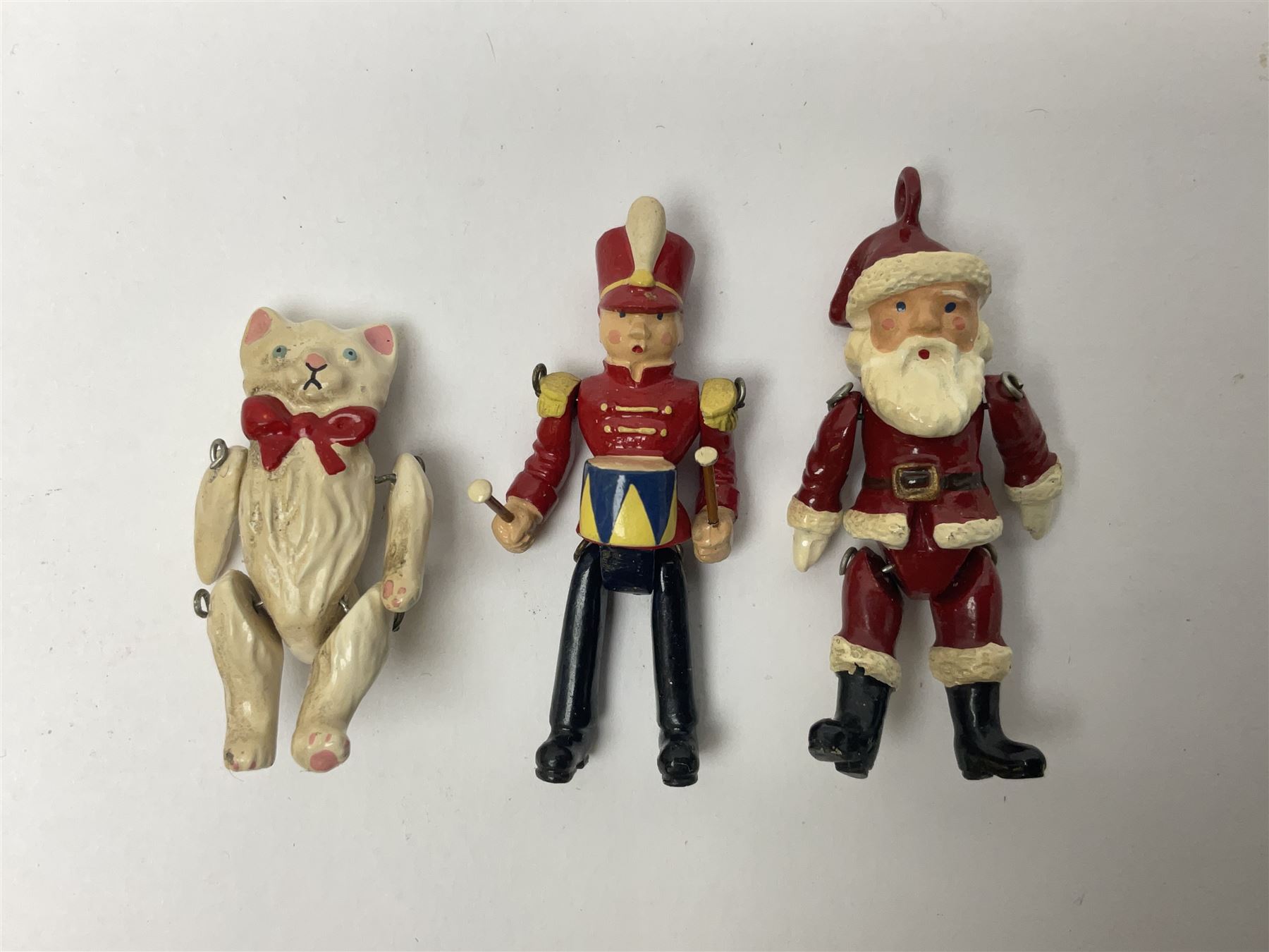 Six Hantel miniature articulated pewter figures, including Father Christmas, Drummer, pig etc 