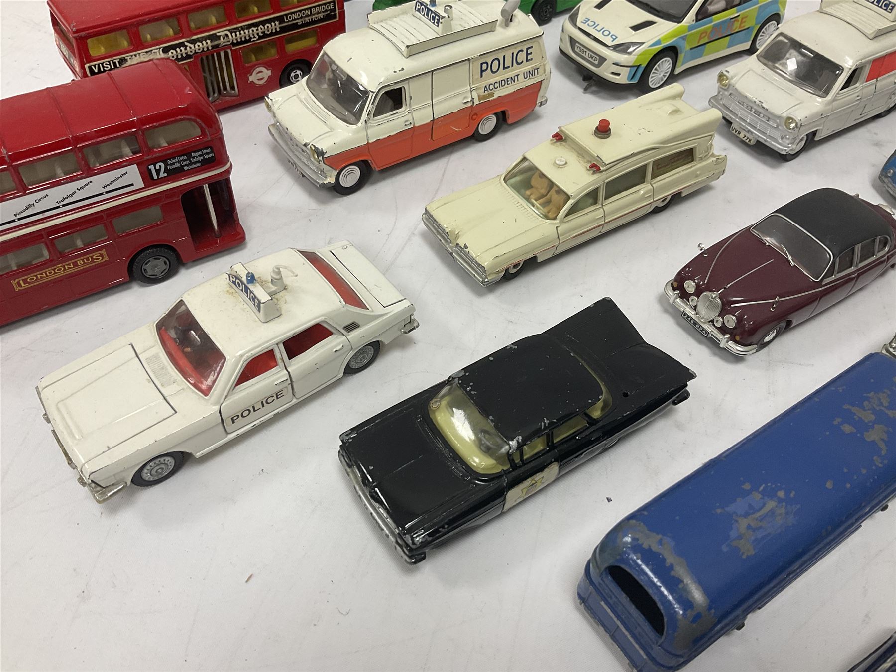 Corgi/Dinky - twenty-four unboxed and playworn die-cast models, predominantly emergency vehicles and buses; including Autocar Isobloc, Superior Criterion Ambulance, Ford Transit Police Vans, Chevrolet Impalas, Minissima, Ausin Mini Police van etc (24)