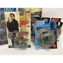 Corgi - The Definitive Bond Collection and The Director's Cut - nine die-cast vehicles from You Only Live Twice, Goldfinger, For Your Eyes Only, Diamonds Are Forever etc; Corgi Classics Moonraker Shuttle and Lotus Esprit; two other Corgi James Bond packs; Carrera Die Another Day Aston Martin V12 Vanquish; nine Johnny Lightning carded James Bond vehicles; Dragon carded Wai Lin figure; and three Fabbri tanks; all boxed/packaged (27)
