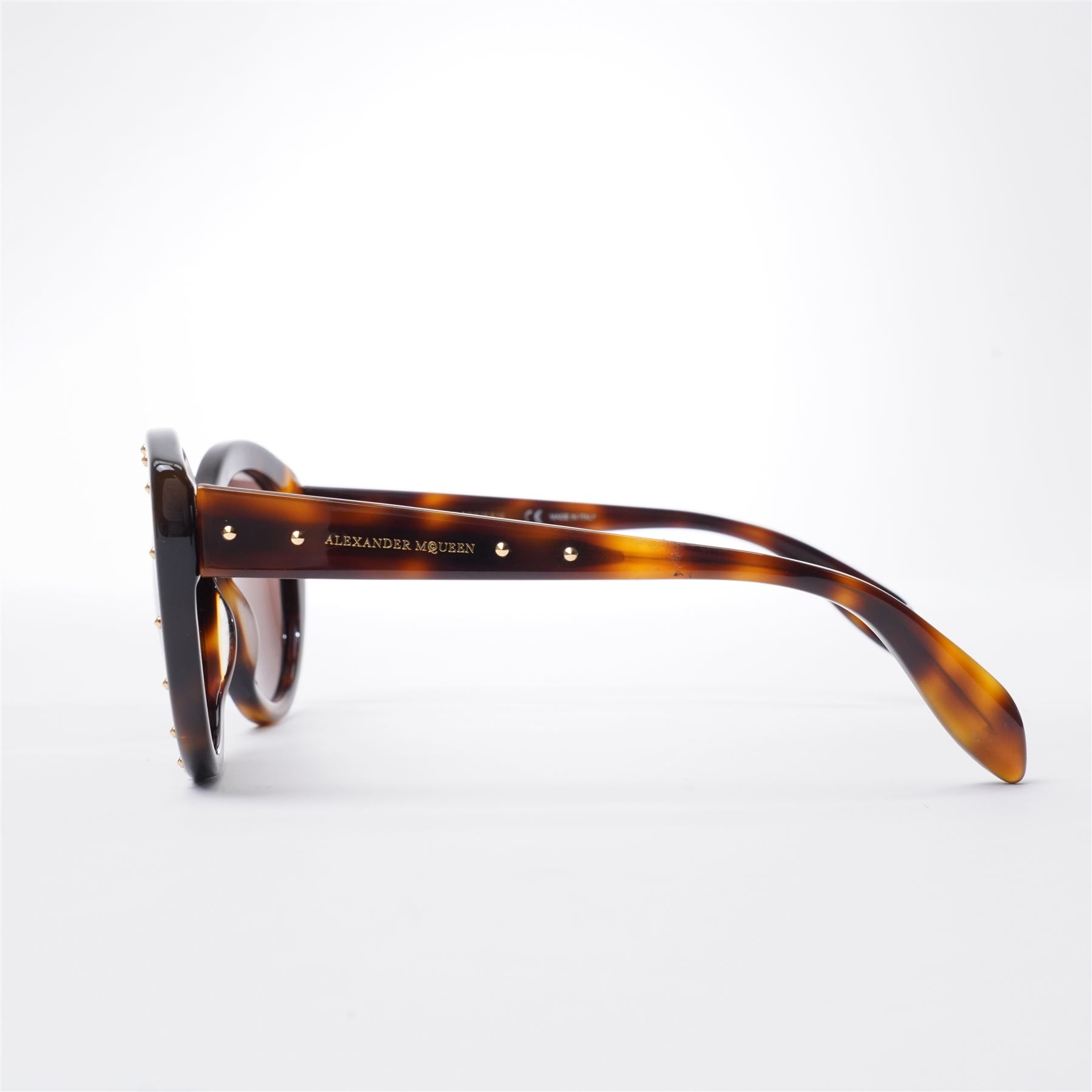 Alexander McQueen - pair of oversized sunglasses, with tortoiseshell-effect acetate frames and gradient tinted lenses, the fronts studded with gold-tone metal rivets, the arms signed ‘Alexander McQueen’, with original hard case and box