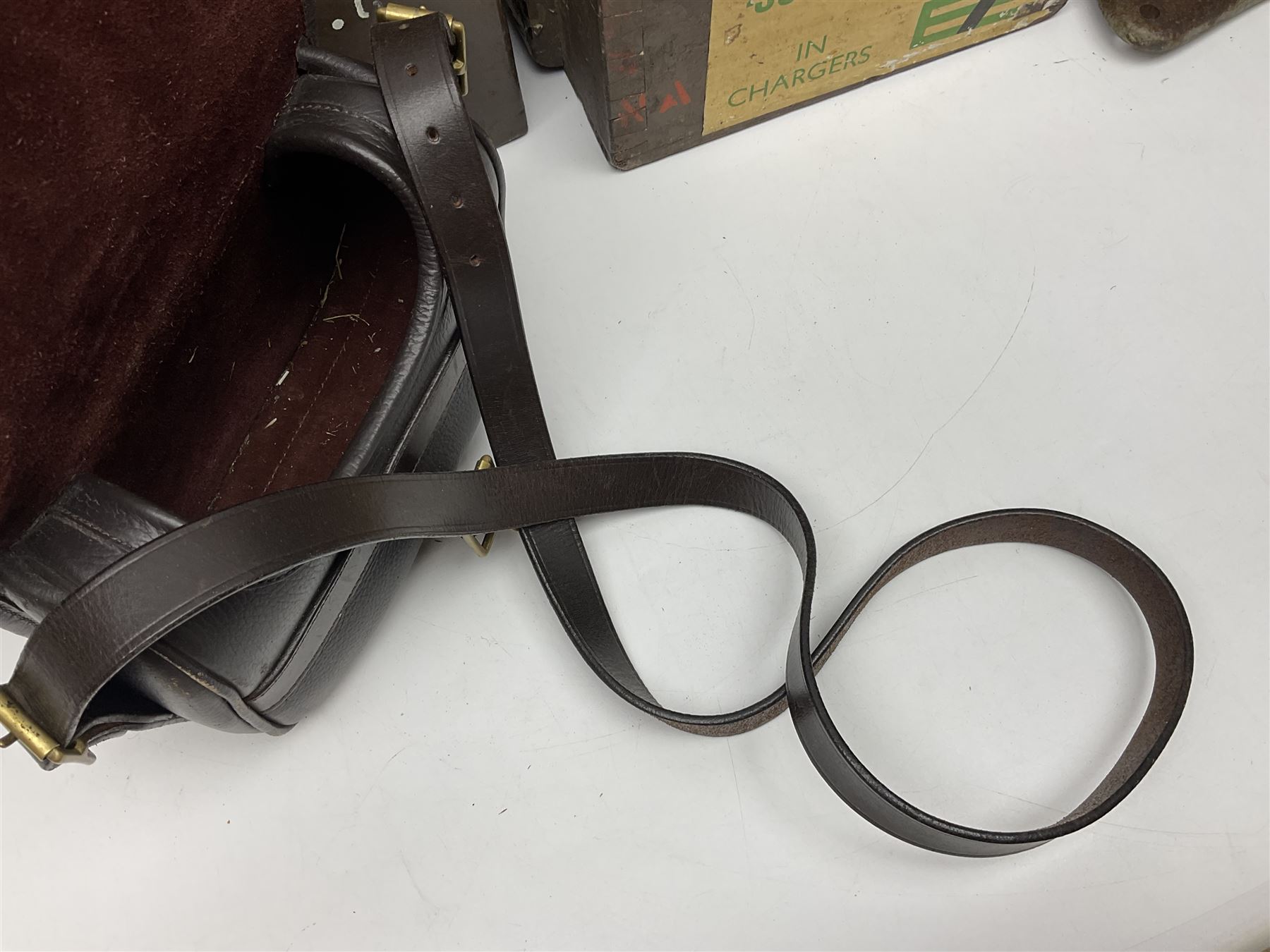 Miscellaneous shooting accessories - W.J. Bowman & Sons clay pigeon launcher; two leather cartridge belts; three cartridge bags; two canvas/leather game bags; and two metal/wooden cartridge boxes