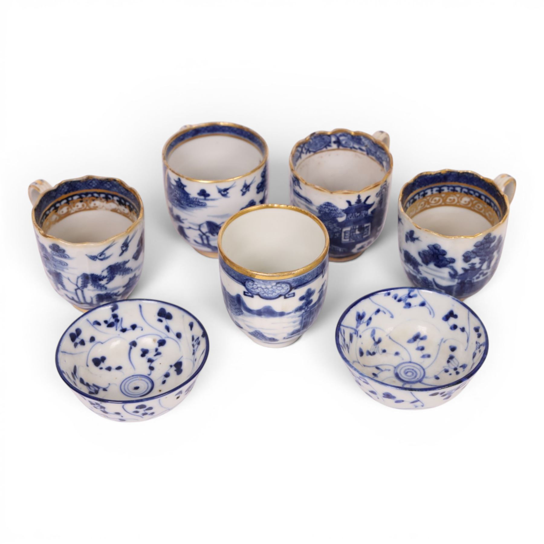 Five 18th century Qing Dynasty export coffee cups, all similar decoration in blue and white with gilt detail, together with two tea bowls  
