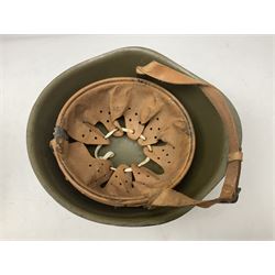 Two 1960s East Block Soviet style helmets - Czechoslovakian and Russian; both with liners (2)