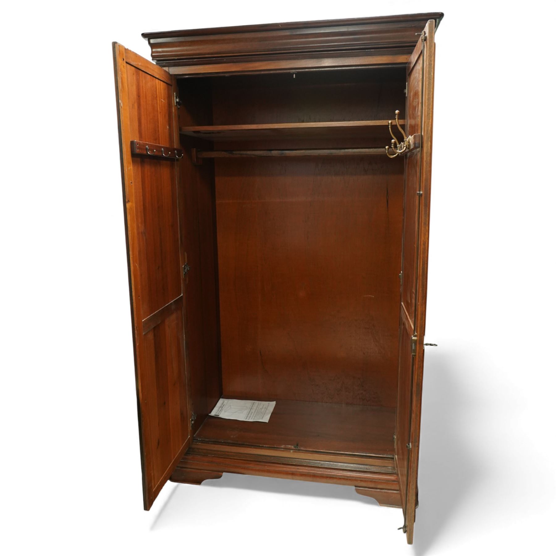 Willis & Gambier - French cherry wood double wardrobe, moulded cornice above two panelled doors opening to a hanging interior with rail and shelf, raised on bracket feet