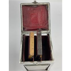 Edwardian silver mounted playing card case, hallmarked William Harrison Walter, Birmingham 1903, the sides each with a period playing card set behind a bevelled glass panel, the hinged cover with later engraving 'Presented to Norman T Crombie Esq by the officers & men of the 31st WR Detachment for services rendered 1917-1918', with red leather lined interior, the three compartments upon a sprung base and containing two later wooden Whist markers, case H12.5cm