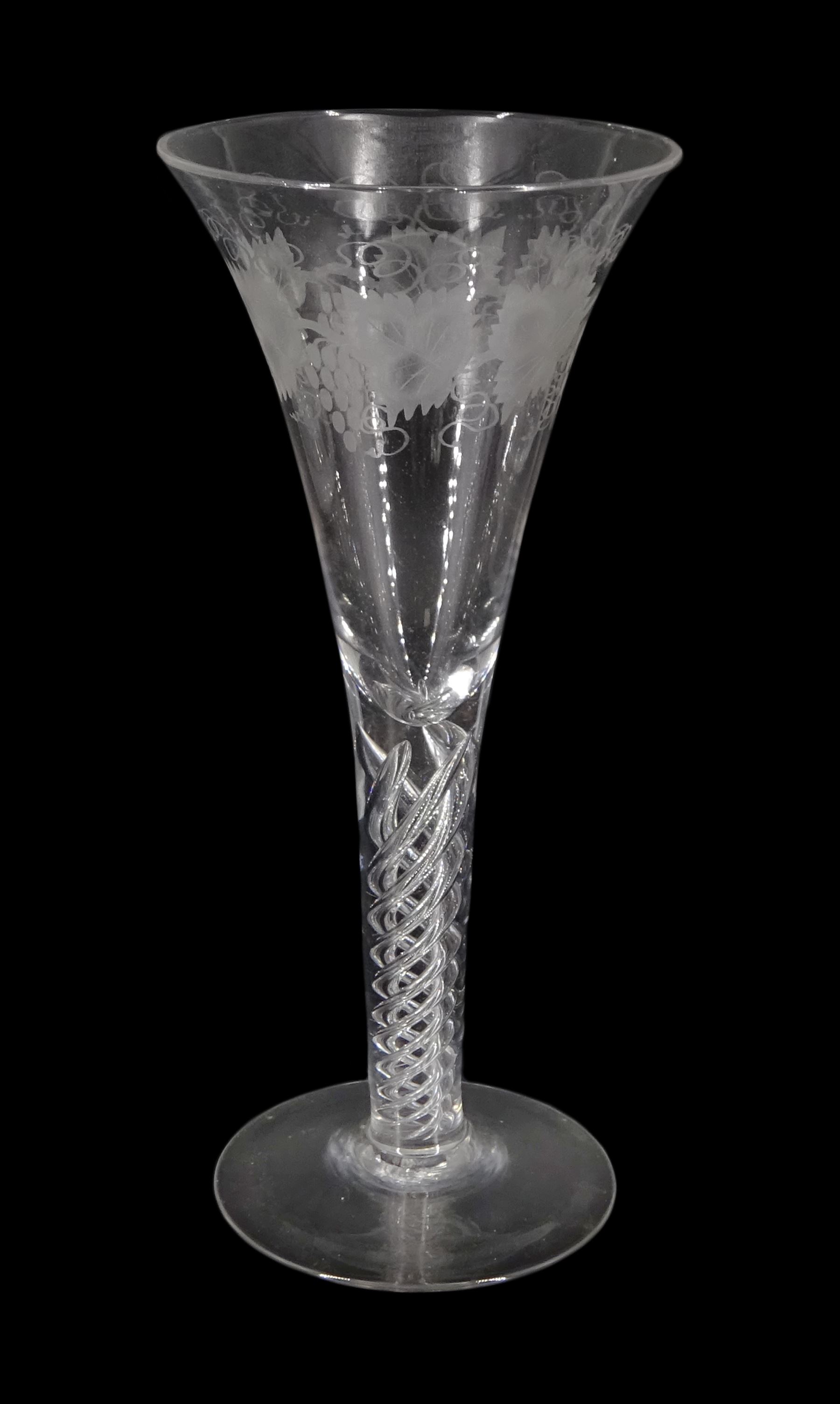 Large 19th century wine glass, the drawn trumpet bowl engraved with fruiting vine, upon single series mercury twist stem and conical foot, H25cm 